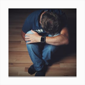 Depressed Man Sitting On The Floor Canvas Print