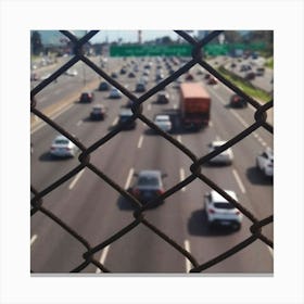 Traffic Through A Chain Link Fence Canvas Print