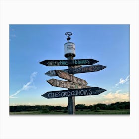 A Weathered Wooden Signpost At A Crossroad Its Arrows Pointing In Various Directions With Hand Pain (5) Canvas Print