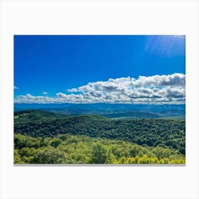 Cumulus Clouds Strewn Across A Blue Sky Above A Sweeping Scenic Landscape Vibrant Greenery Rollin Canvas Print