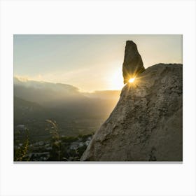 Golden sunlight and rocks at sunset Canvas Print