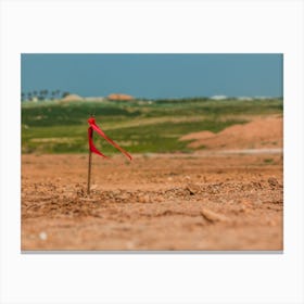 Metal Survey Peg With Red Flag On Construction Site Canvas Print