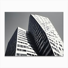 Black And White Photo Of A Modern Skyscraper With A Unique, Angular Design, Emphasizing Its Architectural Lines And Shapes Canvas Print