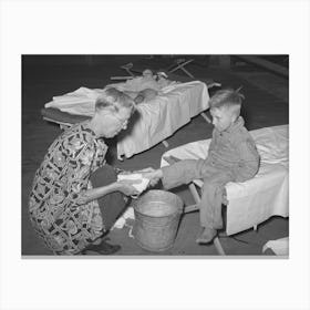 Wpa (Work Projects Administration) Nursery School Attendent Washing Dirty Feet Of The Children Before They Their Canvas Print