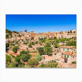 Idyllic view of Valldemossa, mediterranean Mallorca village at Spain. Village landscape of Valldemossa on Majorca, Spain Balearic Islands. A serene village landscape of Valldemossa, nestled in the scenic Balearic Islands of Spain. Canvas Print