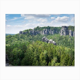 Green forest and sandstone rocks near the Bastei in Saxon Switzerland Canvas Print