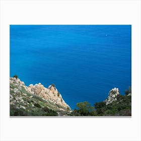 Blue sea water and cliffs on the coast Canvas Print