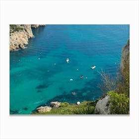 Turquoise sea water, cliffs and boats Canvas Print