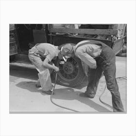 Migrants On The Road Checking Tires At Filling Station Near Henrietta I E Henryetta Oklahoma By Russell Lee Canvas Print