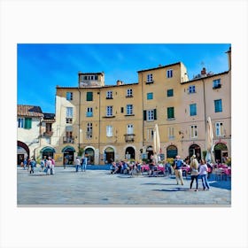 Piazza dell'Anfiteatro in Lucca. The vibrant Piazza dell'Anfiteatro in Lucca, Italy, is a unique elliptical square built on the remains of an ancient Roman amphitheater. Surrounded by colorful historic buildings, the square is bustling with life, featuring outdoor cafes, shops, and visitors enjoying the lively atmosphere. 1 Canvas Print