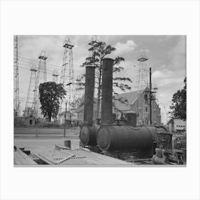 Oil Well Boilers With Church And Oil Derricks In The Background, This Is Reputed To Be One Of The Richest Canvas Print