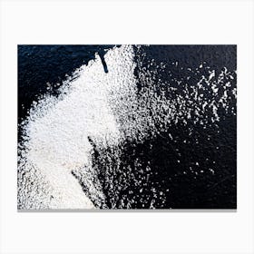 White Powder On A Black Wall. Canvas Print