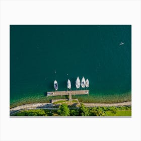 Yachts and sailboats from above, moored on Lake Orta. Piedmont, Italy. Drone photography. Canvas Print