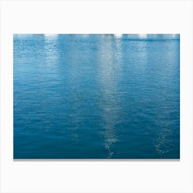 Reflections in blue sea water Canvas Print