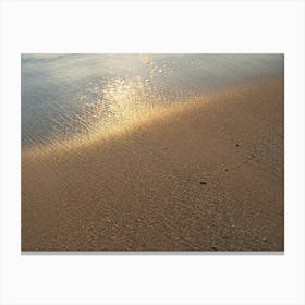 Reflections of sunlight on the sandy beach Canvas Print