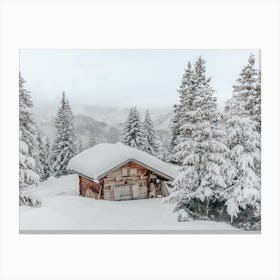 Cabin In Snow Covered Woods Canvas Print