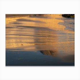 Reflection of the evening light in wet sand Canvas Print