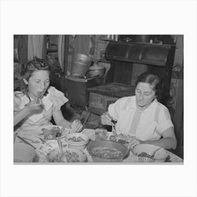 Mrs, Browning And Her Daughter Eating Dinner, This Family Does Much Canning In Line With Fsa (Farm Security Canvas Print