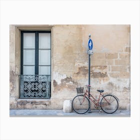 Bicycle Against A Wall Canvas Print
