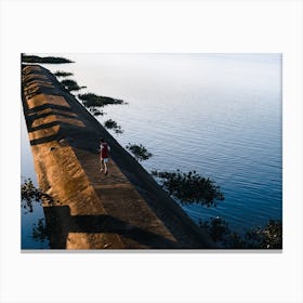 Boy Running Across A Bridge In Vietnam Canvas Print