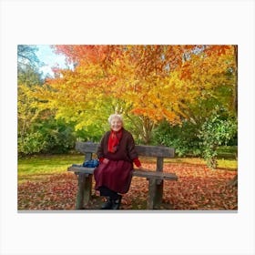 Elderly Woman Radiating Joy Seated On A Rustic Wooden Bench In A Lush Park Surrounded By A Kaleido (1) Canvas Print