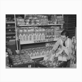 Grocery Store Clerk Places Loaves Of Bread On Display Racks, San Angelo, Texas By Russell Lee Canvas Print