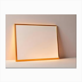 A Golden Picture Frame Against A Light Colored Wall And White Surface Canvas Print