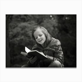 Little Girl Reading A Book Canvas Print