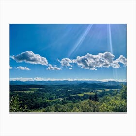 Cumulus Clouds Strewn Across A Blue Sky Above A Sweeping Scenic Landscape Vibrant Greenery Rollin (5) Canvas Print