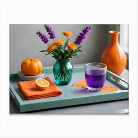 A Still Life Photograph Of A Tray With A Variety Of Colorful Objects, Including A Vase Of Purple And Orange Flowers, An Orange Pumpkin, An Orange Slice, And A Glass Of Purple Juice Canvas Print