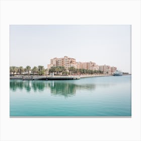 Buildings With Palm Trees And Water Canvas Print