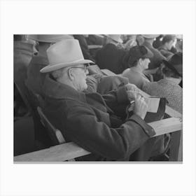 Spectator Checking Time Of The Calf Ropers At The Rodeo At The San Angelo Fat Stock Show, San Angelo, Texas By Canvas Print