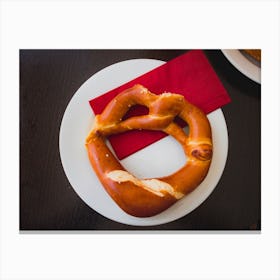 Pretzel Bread On White Plate On Wooden Table Canvas Print