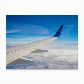 Airplane Wing On The Sky And Over Sea With Clouds Canvas Print