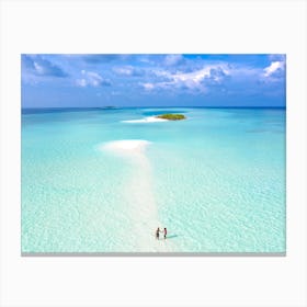 Two People Walking On A Beach Canvas Print