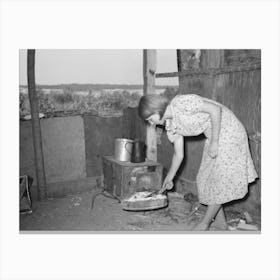 Girl Tending Fire In Shack Home, Tin Town, Caruthersville, Missouri By Russell Lee Canvas Print