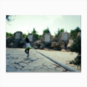 Young Girl Trying To Go Into The Distance As She Tied By A Rope Canvas Print