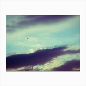Silhouette Of An Airplane Flying In Sunset Sky Canvas Print
