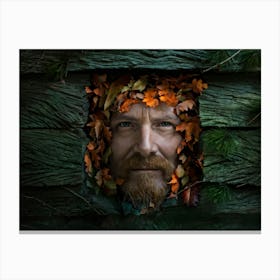 Portrait Of A Weathered Man Face Composed Of Colored Leaves Ranging From Autumnal Oranges To Deep E Canvas Print