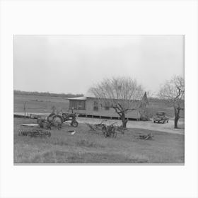 Farmhouse Of Small Farmer Near Santa Rosa, Texas, Tractor And Rusting Farm Implements Are In The Yard, Showing Canvas Print