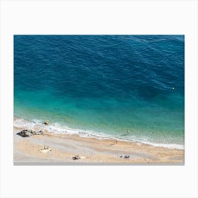 Aerial view of a beach and blue sea water Canvas Print