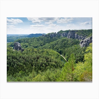 Sandstone rocks and green forest in the Amselgrund, Saxon Switzerland National Park Canvas Print
