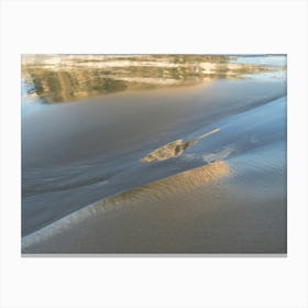 Reflections on the sandy beach Canvas Print
