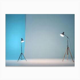 Photo Of Two Lamps With Light Shining On A Blue Backdrop In A White Room Canvas Print