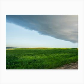 Storm Clouds Over A Green Field Canvas Print