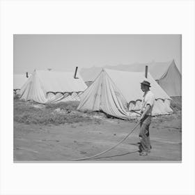 Farm Worker Watering Down The Dusty Ground Around His Tent At The Fsa (Farm Security Administration) Migratory Lab Canvas Print