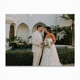 A Couple Sharing A Moment Of Joy During Their Honeymoon Bride In A Flowing White Dress And Groom In (5) Canvas Print