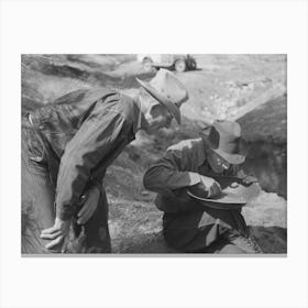 Gold Prospector Blowing Away Dirt To Find The Gold In His Pan While A Visiting Prospector Looks On, Pinos Altos, New Canvas Print