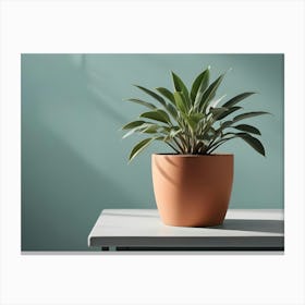 A Potted Plant With Green Leaves On A White Table Against A Blue Wall Canvas Print