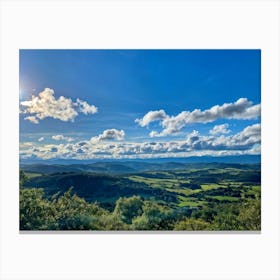 Cumulus Clouds Strewn Across A Blue Sky Above A Sweeping Scenic Landscape Vibrant Greenery Rollin (3) Canvas Print